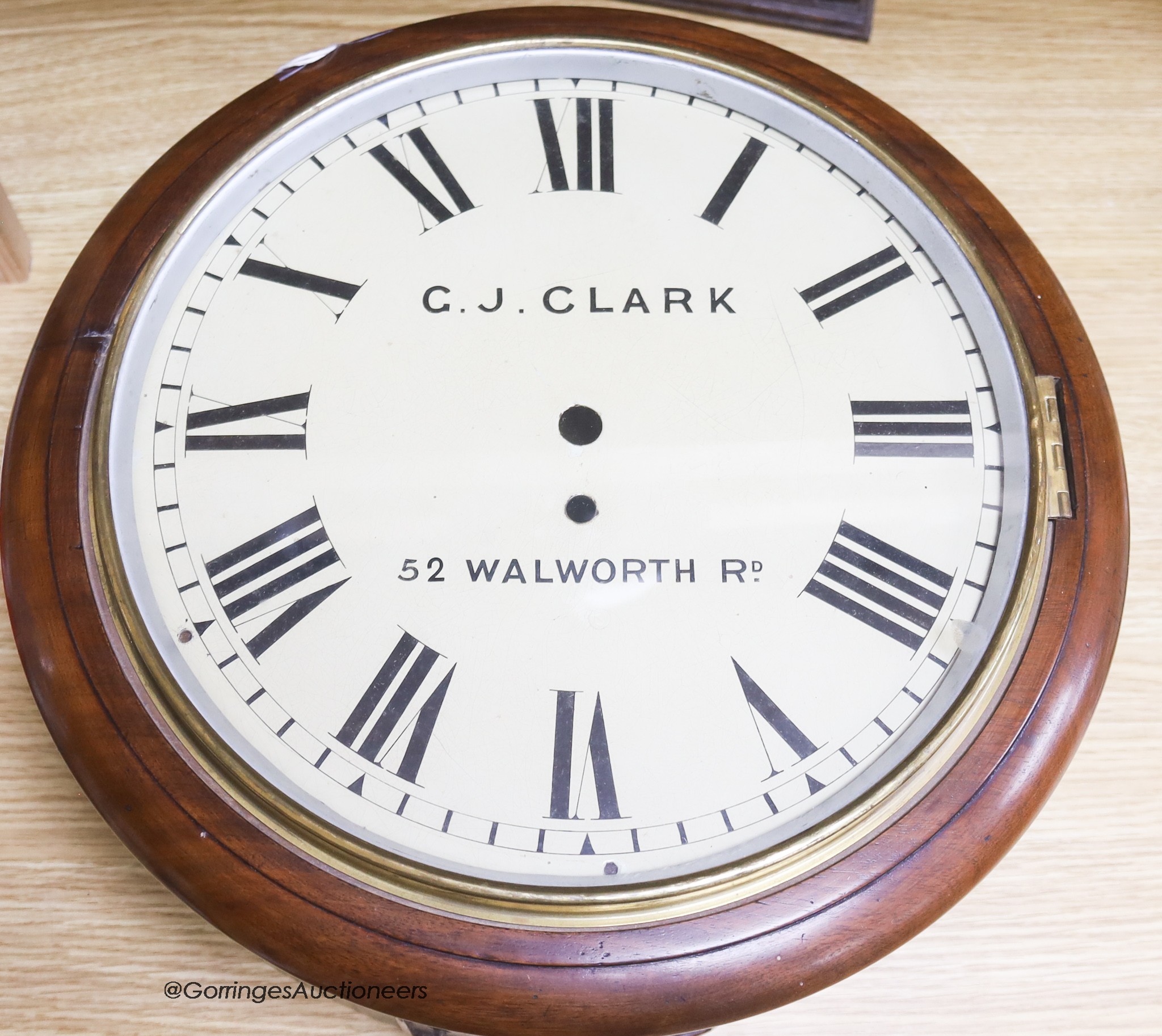 A Victorian mahogany circular wall clock, by G.J. Clark, pendulm but no key, diameter 38cm